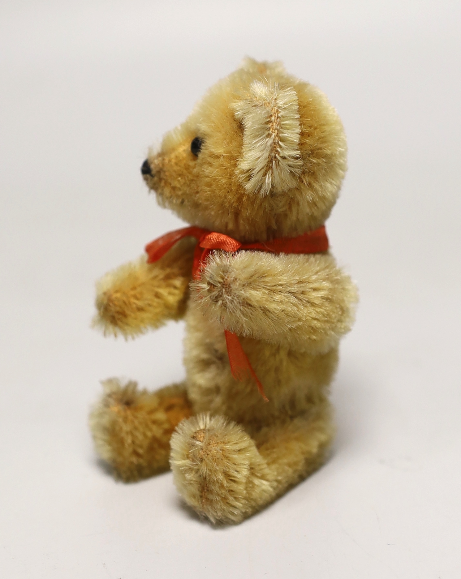 A Schuco perfume bear, 1950's, 5in., excellent condition, bottle complete